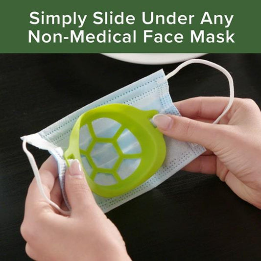 Close up of woman's hands holding a black face mask with a Cool Turtle under it. Headline says Simply Slide Under Any Non-Medical Face Mask