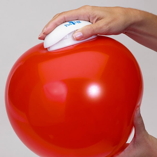 Someone running a PedEgg along a balloon