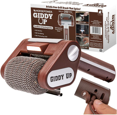 A Horsepower Giddy Up cordless, motorized grill cleaning brush with a spinning mesh roller, shown in front of its product packaging.