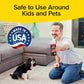 A man kneels by a small dog, holding a Horsepower Bull Shot carpet cleaner and odor eliminator spray. Text above says Safe to Use Around Kids and Pets, with a Made in USA badge displayed.