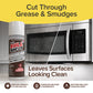 A can of Bull Shot Stainless Steel sits before a microwave, showing one shiny, streak-free side and one greasy, smudged side. Text highlights its powerful cleaning and restoration for stainless steel surfaces.