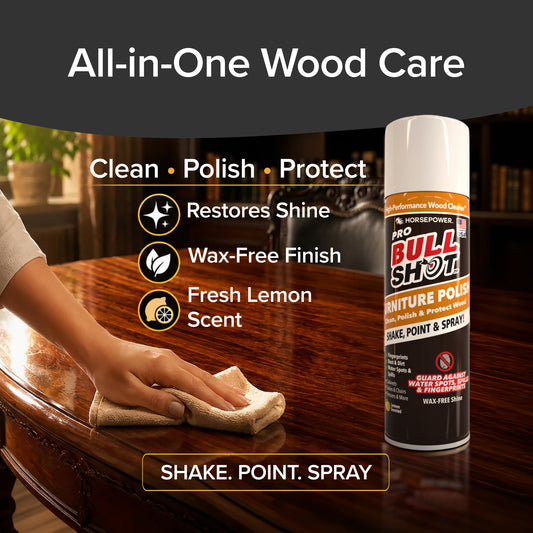 A hand uses a cloth to polish a glossy wooden table beside a can of Bull Shot Furniture Polish. Text highlights its features: cleans, removes dust and fingerprints, polishes, protects, restores shine, wax-free finish, fresh lemon scent.