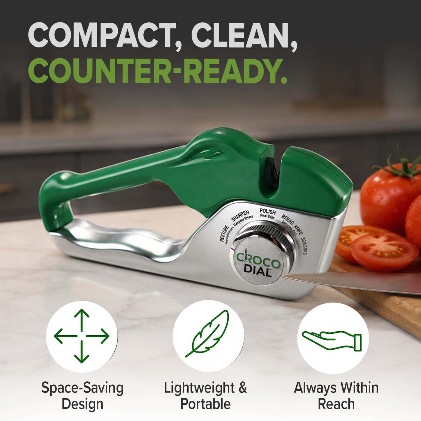 A green and silver Croco Dial kitchen tool with a 5-in-1 sharpening system sits on a counter near sliced tomatoes. Text says "Compact, Clean, Counter-Ready," with icons for its space-saving, lightweight design.