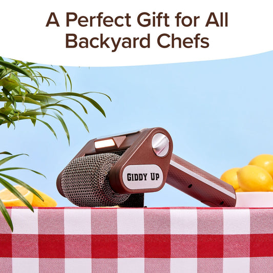 A Horsepower Giddy Up handheld grill brush with a roller head on a red and white checkered tablecloth, beneath the text A Perfect Gift for All Backyard Chefs.