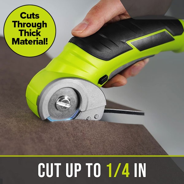 A hand operates the Cordless Electric Cutter on fabric, demonstrating its powerful yet lightweight design. Text on image reads: “Cuts through thick material! Cuts up to 1/4 in.” Features a self-sharpening stainless steel blade for effortless, precise cutting.
