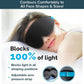 A woman lies on a pillow wearing the Blackout Sleep Mask, a black 3D contoured mask with blue adjustable straps. Text highlights that this sleep mask blocks 100% of light and features an adjustable, pressure-free strap for optimal comfort.