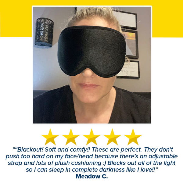 A woman wearing the Blackout Sleep Mask, accompanied by a five-star review from Meadow C. highlighting its comfort and exceptional light-blocking qualities.