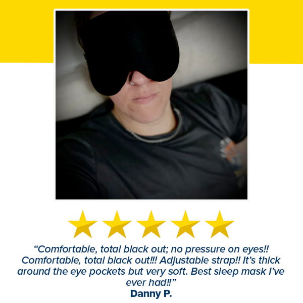A person wearing the Blackout Sleep Mask and a dark shirt smiles slightly. Below is a five-star review from Danny P., praising the mask’s comfort, blackout effect, adjustable strap, and softness.