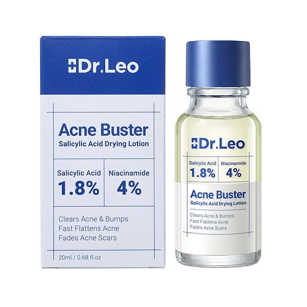 A bottle of Dr. Leo Acne Buster salicylic acid acne spot treatment next to its cardboard packaging, both labeled with 1.8% salicylic acid and 4% niacinamide.