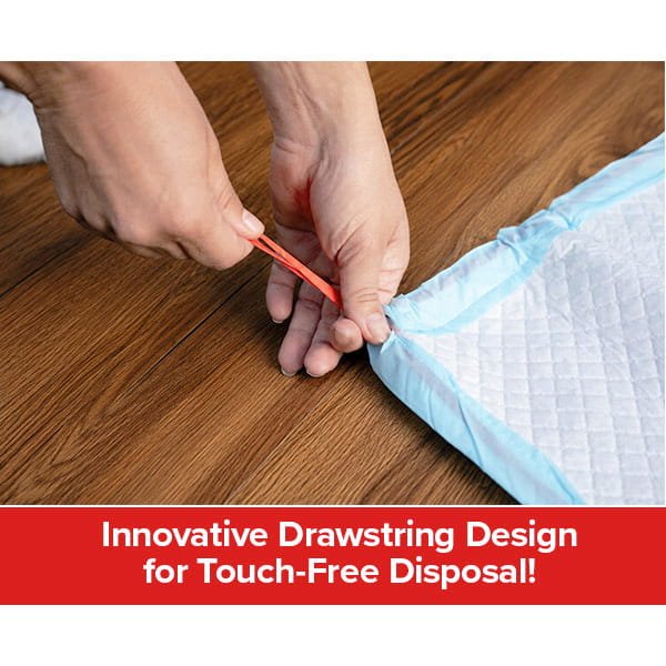 Hands pulling a red drawstring on a blue Drawstring Pee Pad (Includes 25 Pads) placed on a wooden floor, with text below highlighting its innovative touch-free disposal design. This pee pad also offers leak-proof and odor control features, making cleanup simple and hygienic.