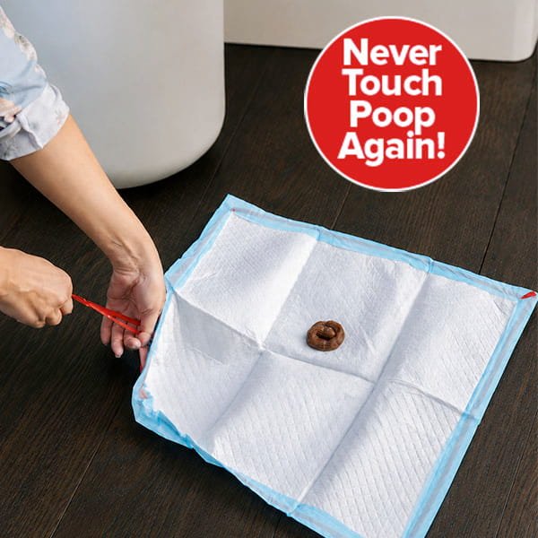 A person uses a red tool to pick up a Drawstring Pee Pad (Includes 25 Pads) with poop on it. A red circle in the corner reads, Never Touch Poop Again! The scene is indoors on a dark floor.