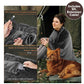 A woman wrapped in a grey Electric Heated Shawl sits by a tent with her dog, with insets showing the 5-foot extension cable and the built-in pocket for a power bank.