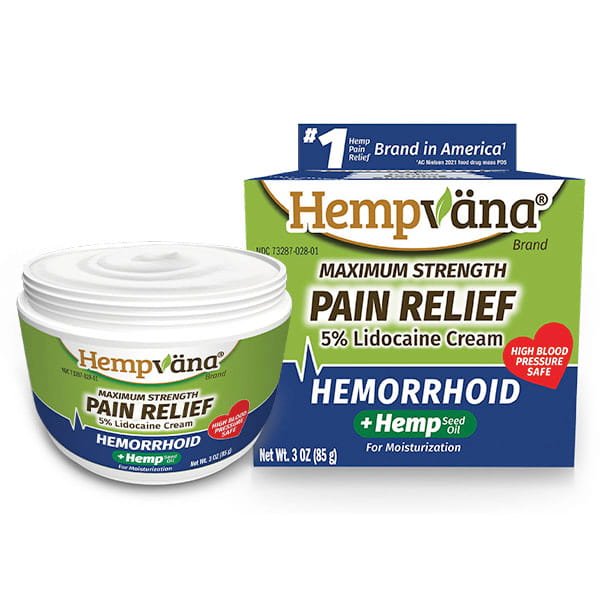 Hempvana Hemorrhoid, featuring 5% lidocaine and hemp seed oil, is a maximum strength hemorrhoid relief cream displayed in a white jar with blue, green, and yellow box packaging. The product highlights powerful pain relief, moisturizing benefits, and safety for individuals with high blood pressure.