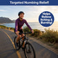 A smiling person in a helmet rides a bike along a coastal path. Text above says, Targeted Numbing Relief! and a bubble reads, Helps Relieve Itching & Burning! Featuring lidocaine and soothing hemp seed oil, Hempvana Hemorrhoid cream keeps you comfortable on the go.