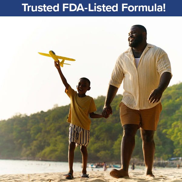 A smiling man and child walk on a sandy beach. The child holds a yellow toy airplane up. Trees and hills are in the background. Text reads: Trusted FDA-Listed Lidocaine Formula from Hempvana Hemorrhoid!.
