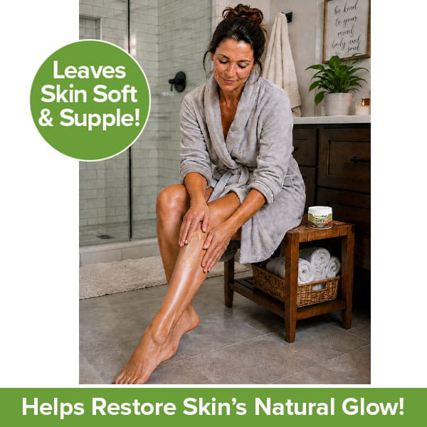 A woman in a bathrobe applies Hempvana Cocoa Butter, infused with hemp seed oil, to her legs in a bathroom. Text reads: Leaves Skin Soft & Supple! and Helps Restore Skin’s Natural Glow!.