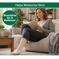 A woman sits on a beige sofa reading a book, with a Hempvana Plantar Fasciitis Pain Relief Patch on her left foot. Text says, Helps Moisturize Skin! Nourishes As It Relieves! The room looks bright and cozy.