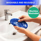 A person washes a blue oval Car Windshield Cleaner microfiber pad with soap under a sink faucet. The image shows "Washable and reusable" at the top and "Machine washable!" in a green circle, emphasizing streak-free cleaning.