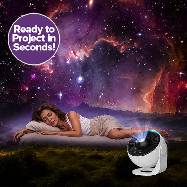 A woman sleeps outdoors on a mattress as the Galaxy Projector for Bedroom fills the night with colorful, starry light. Text reads: Ready to Project in Seconds!.