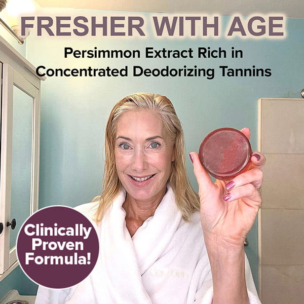 A woman in a white robe holds a bar of Kaori Soap Bar for Old People Smell, with text overlays reading Fresher with age and Clinically proven formula to highlight its effectiveness in eliminating nonenal odor.