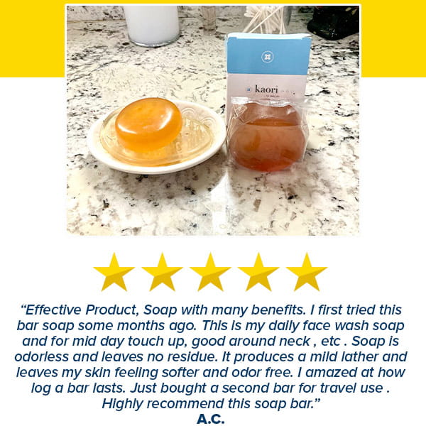 A round, translucent Kaori Soap Bar for Old People Smell on a small dish next to a boxed bar, accompanied by a five-star review.