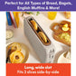 A Slim Toaster Fits Anywhere sits on a kitchen counter, holding two bagel halves in its long, extra-wide slots. Sliced bagels, a cutting board, butter, and toppings are arranged around the toaster. Text above reads: Perfect for All Types of Bread, Bagels, English Muffins & More!.