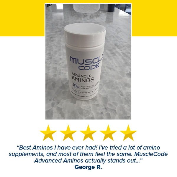A bottle of Muscle Code Essential Amino Acid Capsules sits on a marble counter, with five gold stars and a review from George R. highlighting the product’s benefits for lean muscle growth.