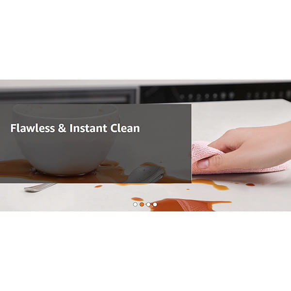 A hand uses a Reusable Microfiber Cleaning Towel (You Get 75 Towels) to wipe a spilled brown liquid near a white bowl and spoon, with the text "Flawless & Instant Clean" overlaid.