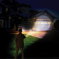 Demonstration of Atomic Beam Flashlight. Man shining Atomic Beam Flashlight on a house at night