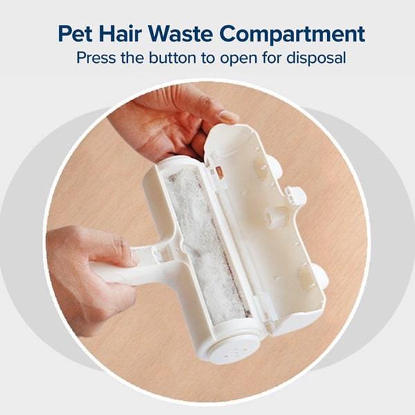 Close up of pet hair waste compartment open on a Pet Hair Remover. Text says "Pet Hair Waste Compartment, Press the button to open for disposal"