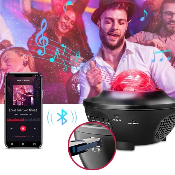 People dancing in a group. Bluetooth Speaker Star Light Projector is emitting red light