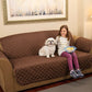 Small girl and dog sitting on a brown Couch Coat laid on a couch